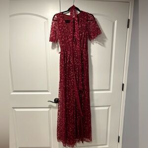 Baltic born women’s burgundy gown with sleeves